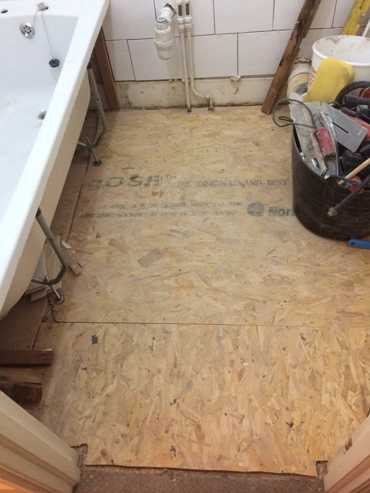Bathroom stripped back with new floor boarding ready for tiling
