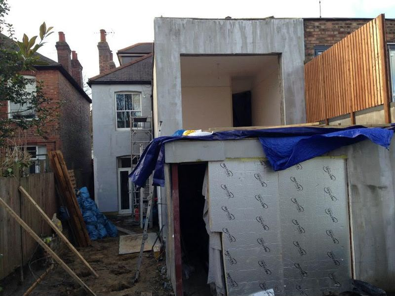 Two-storey rear extension under construction with insulation board