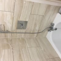 Stone-look shower wall tiling by Aaron Steven Construction