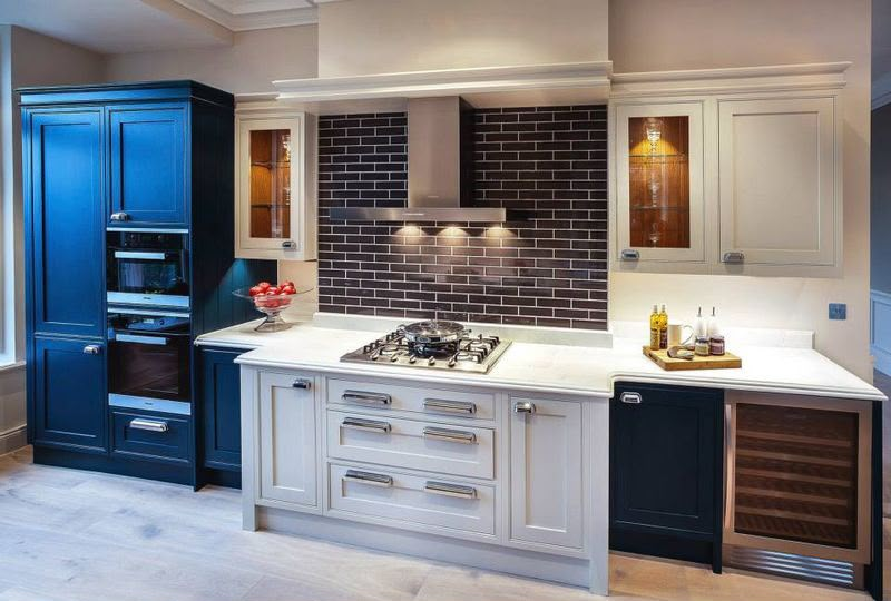 Navy and cream shaker kitchen with brick splashback fitted by Aaron Steven Construction