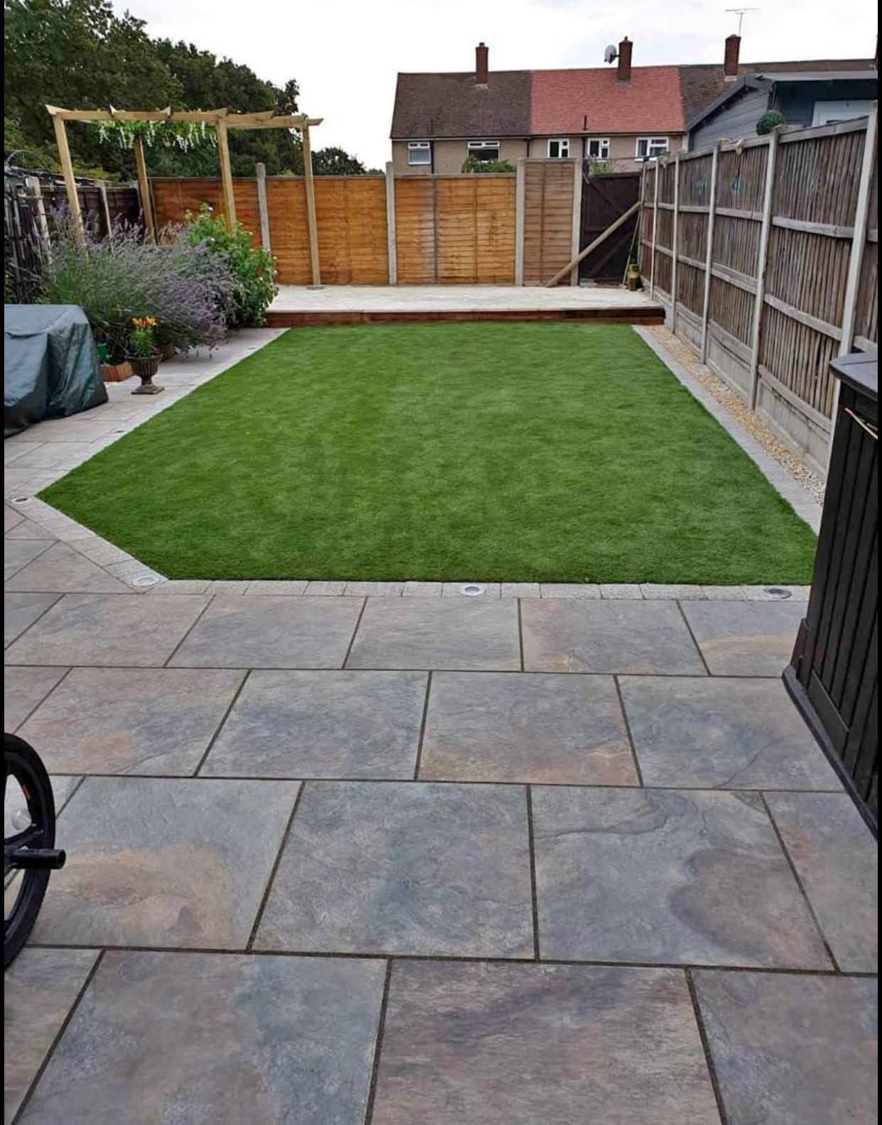 Finished garden with new patio and fresh lawn by Aaron Steven Construction