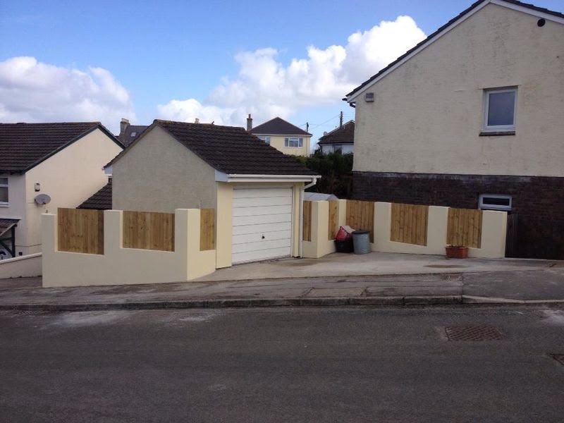 Rendered front boundary wall with timber infill panels and driveway by Aaron Steven Construction