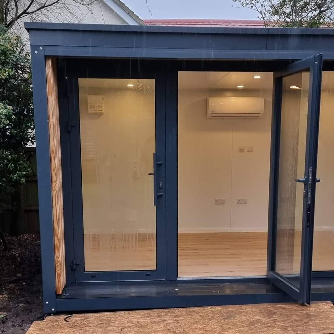 Dark grey garden room with glass doors built by Aaron Steven Construction